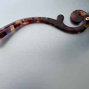 This is a photo of the inner arms of the Prada sunglasses on the site